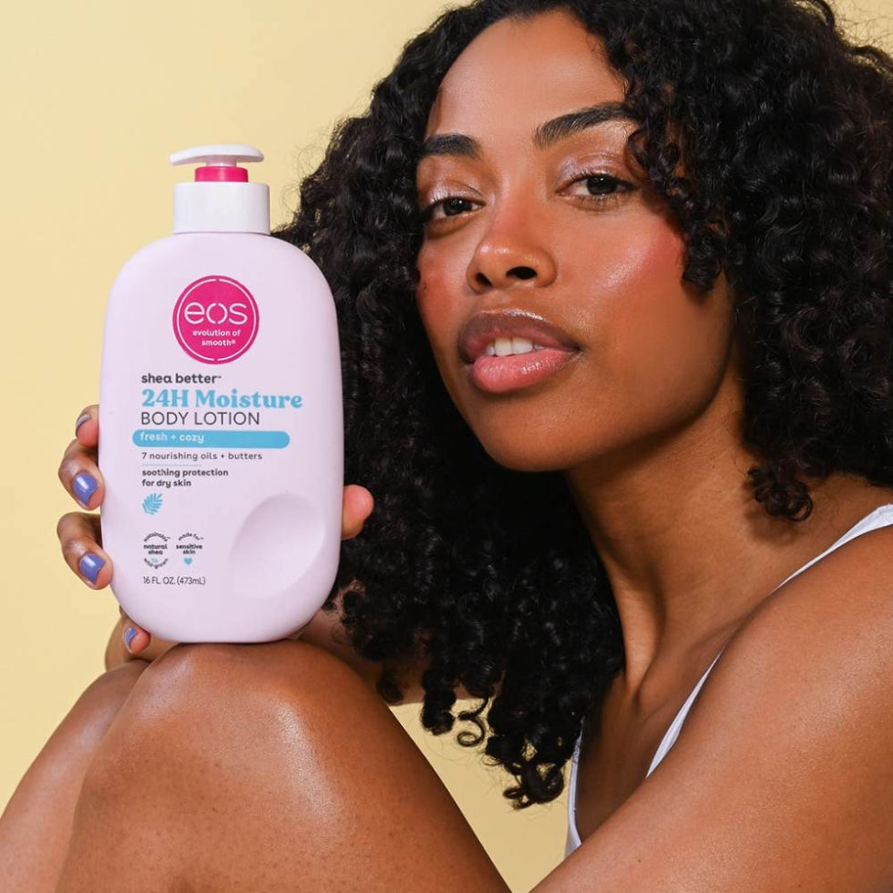 Application shot showing EOS Fresh & Cozy Body Lotion being massaged into clean, dry skin for everyday moisturisation and softness.