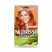 Garnier Nutrisse Ultra Color 7.40 Copper Passion hair dye box showing vibrant copper orange shade result
