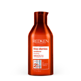 Redken Frizz Dismiss Conditioner 300ml anti frizz smoothing conditioner with Babassu oil helps moisturise detangle control frizz add shine and provide humidity protection for all hair types and textures