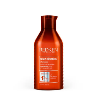 Redken Frizz Dismiss Shampoo 300ml anti frizz smoothing shampoo with Babassu oil gently cleanses hair controls frizz improves softness boosts shine and helps protect against humidity for all hair types and textures